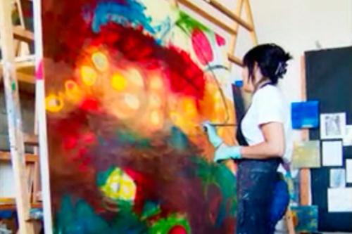 Pauletta painting at her studio.
